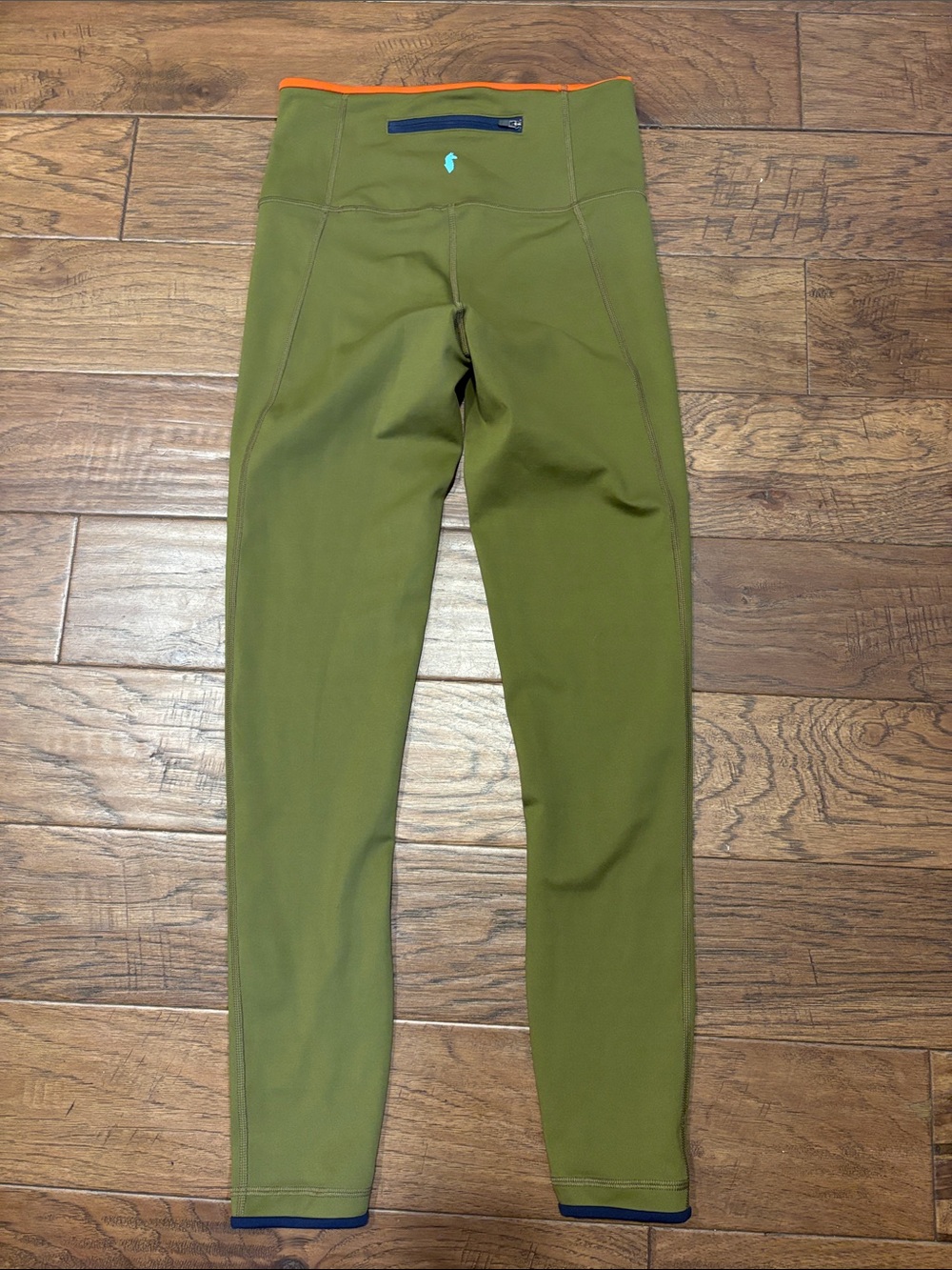 Cotopaxi Olive Green Leggings with Orange Waist Trim and Navy bottom 🦙